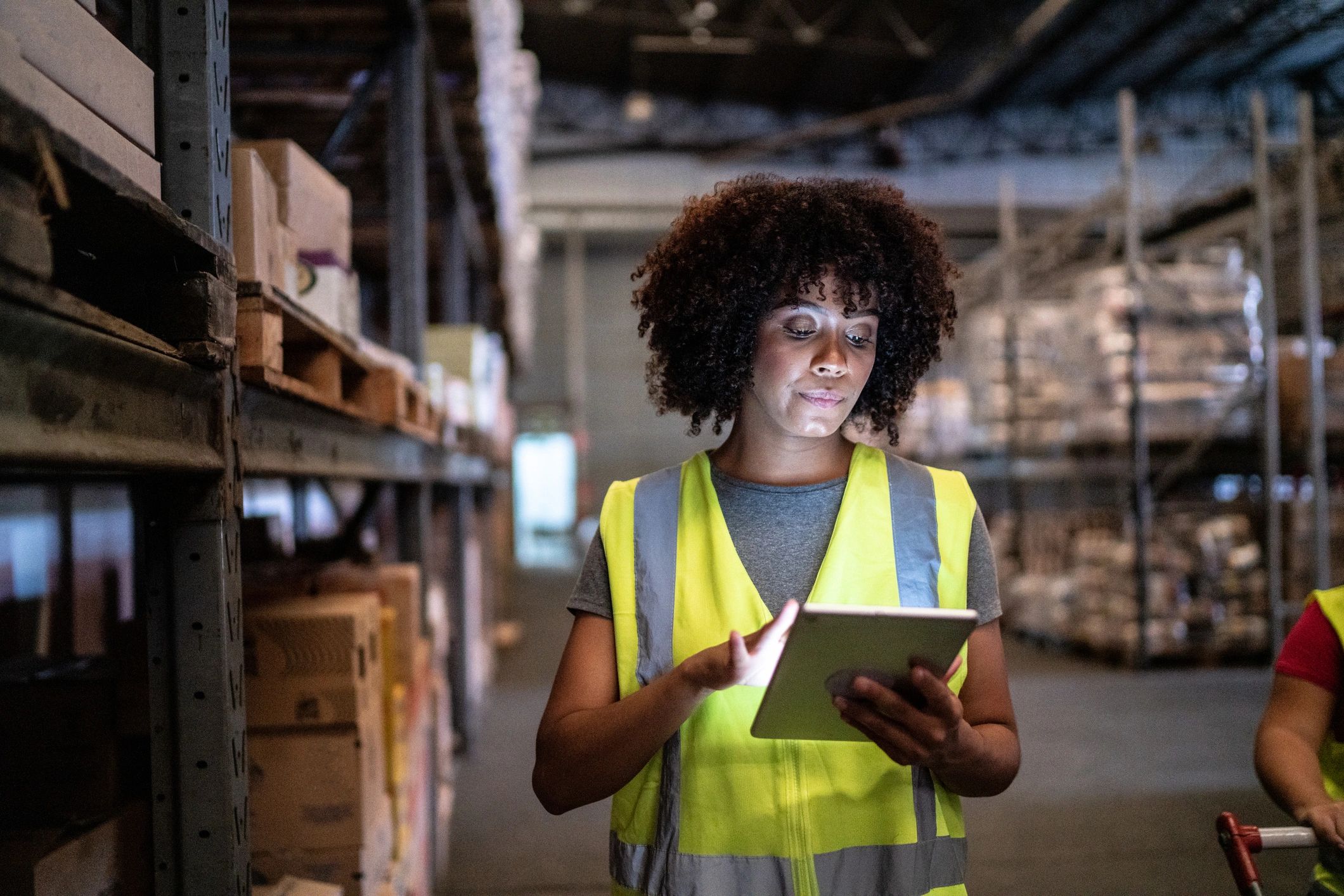 Warehouse professional managing inventory on a tablet