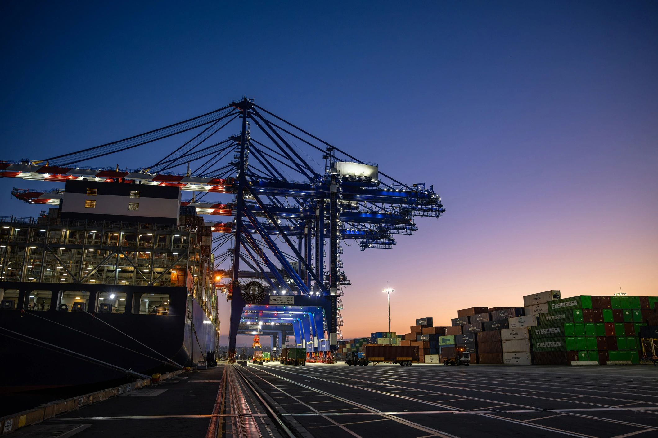 Container ship and cargo cranes at an international port